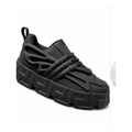 Black sculpted-sole fashion sneaker on a clean white background