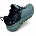 Columbia gray-green and black lace-up shoes on a white background