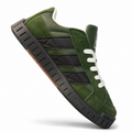 Green and black low-top sneaker on a white background