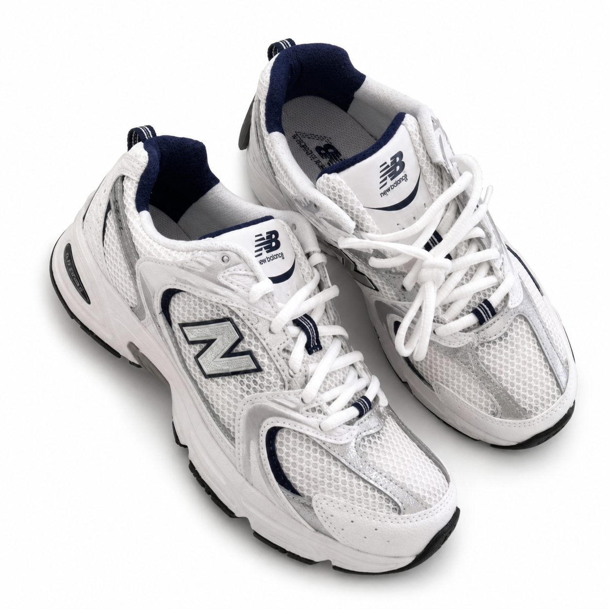 New Balance white mesh athletic shoes on a white background