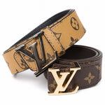 Tan and brown monogram buckle belts with contrasting metal hardware
