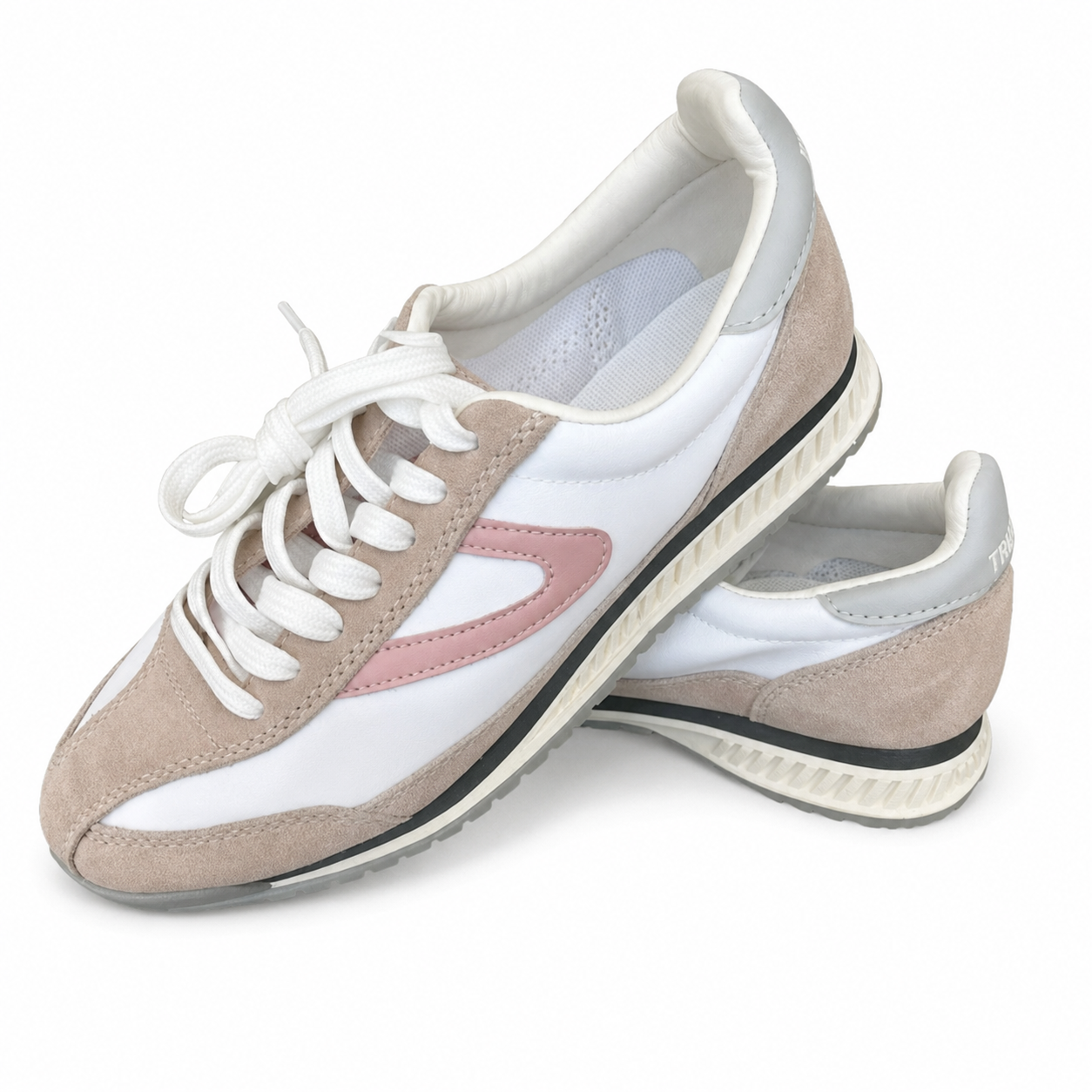 Tretorn white and blush lace-up shoes on a white background