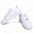 White low-top sneakers on a white background